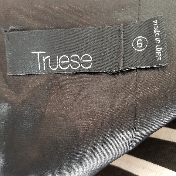 Black halter-neck dress with fringed skirt by TRUESE, size 6 - Picture 6 of 6